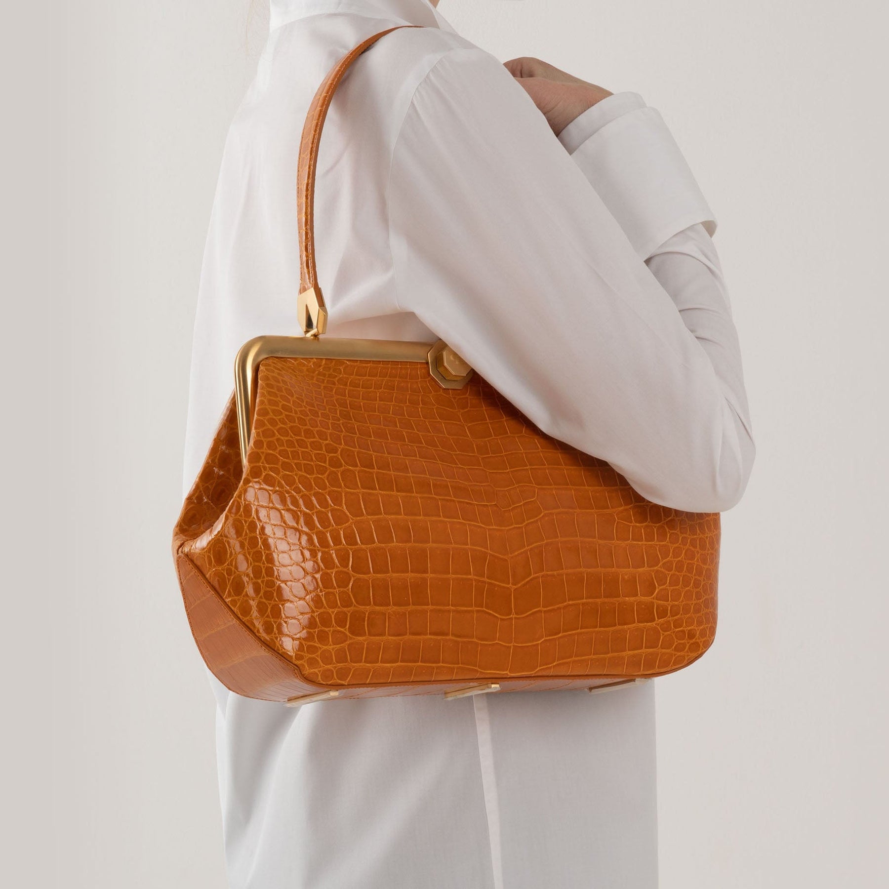 DOTTI Luxury handbags in exotic skins. Luna in crocodile with model. Made in Italy